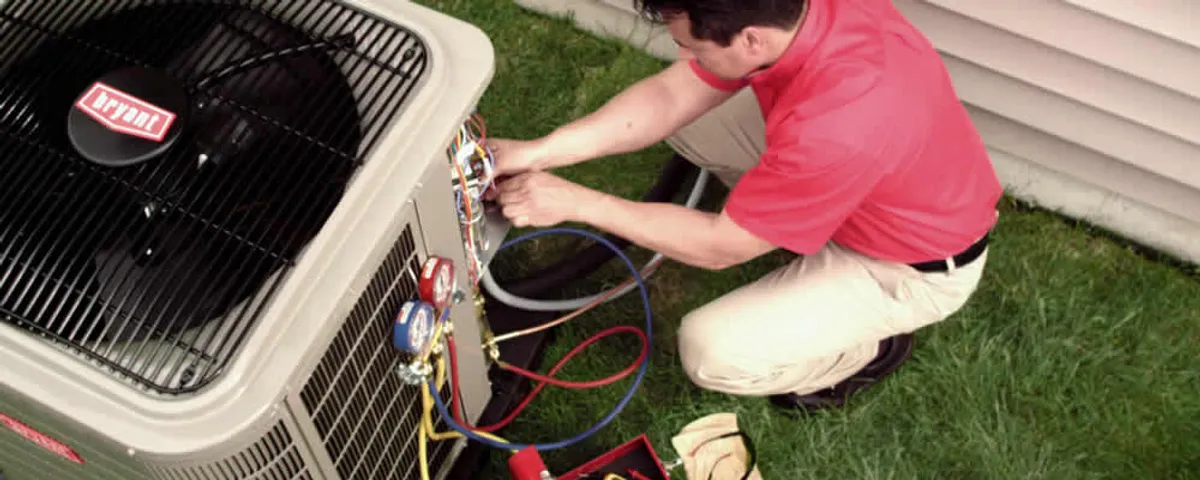 HVAC technician servicing an outdoor air conditioner unit in Cherry Hill, NJ